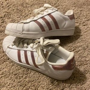 White and rose gold Adidas Superstars